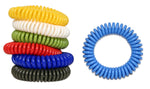 Photo of a stack of assorted colored coiled wristbands on the left and a single blue coiled wristband shown flat on the right.