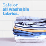 Neatly folded stack of washable clothes against a tiled background with text saying safe on all washable fabrics