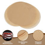 Stack of pre‑cut round unbleached parchment sheets with circular callouts highlighting non‑stick and oil‑proof features.