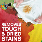 Hands holding a white shirt with a brown stain and bold text saying removes tough & dried stains and Shout logo