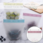 Three frosted stand-up resealable bags on a marble surface with produce inside and enlarged inset showing zip seal.