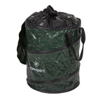 Green Stansport collapsible trash can shown with a tied black garbage bag lining the top and black carry straps.