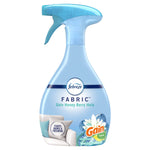 Studio shot of a light blue Febreze Fabric spray bottle labeled Gain Honey Berry Hula