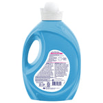Rear view of a blue Suavitel fabric conditioner bottle showing the product information panel and barcode