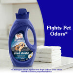 Suavitel Shed Shield blue bottle displayed on a countertop beside folded towels with text 'Fights Pet Odors'
