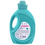 Back of turquoise Suavitel Complete fabric softener bottle showing circular back label with usage and safety text.