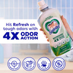 Hand holding a Suavitel Floral Fresh fabric rinse bottle next to large text promoting ‘4X odor action’ and four benefit icons