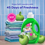 Suavitel Green Apple fabric conditioner bottle with folded towels and green apples promotional scene
