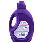 Back view of a purple Suavitel fabric softener bottle showing product information label and cap