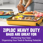 Open suitcase with travel items and a Ziploc heavy duty bag used for packing toiletries and small gear, purple branding below.