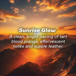 Sunrise Glow branding over a dramatic sunrise mountain landscape with descriptive scent text overlaid.