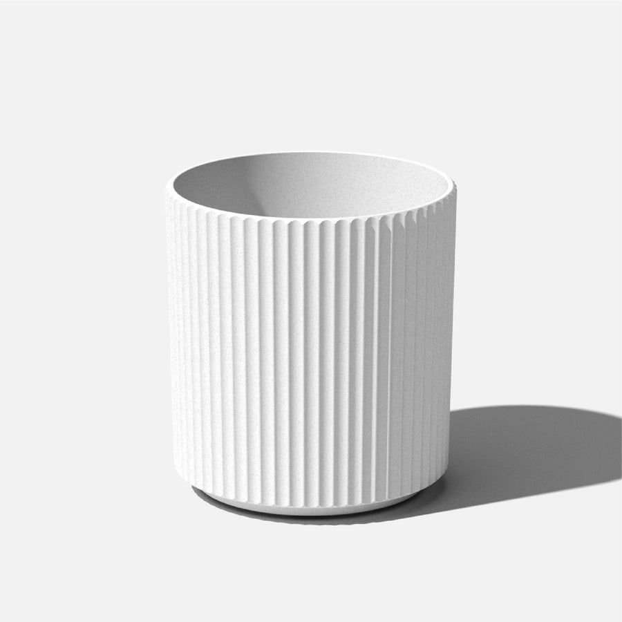 White Sunside by Veradek ripple planter with vertical ribbed texture on neutral background casting a soft shadow