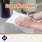 Hand wiping with a textured paper towel sheet beside a countertop roll, overlaid with 'Super Absorbent' text and Member's Mark emblem.