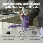 Lifestyle image of a person holding a filled Podsy bottle with a refill pod tube on the counter and certification icons