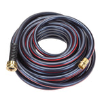 Coiled dark garden hose with a red stripe laid in a spiral showing both brass male and female connectors on white background