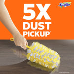 Hand using a yellow Swiffer duster on a wood surface with large text '5X Dust Pickup' on orange background.