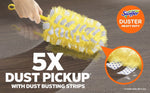 Hand-held yellow Swiffer duster being used on a wood surface with inset magnified view of dust-busting strips and '5X dust pickup' text