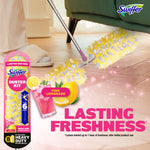 Swiffer duster in use under furniture with packaging and pink lemonade imagery, text reads 'lasting freshness'