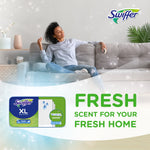 Lifestyle ad with relaxed person on a couch and Swiffer XL fresh scent package promoting fresh scent