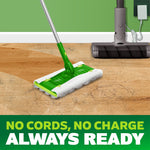 Swiffer Hair Magnet mop head cleaning hair on a wood floor with cordless vacuum shown in background and no cords claim