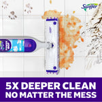 Top-down view of a Swiffer Power Mop cleaning tiled floor with visible orange and muddy messes being removed to illustrate cleaning power
