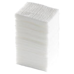 Tall stacked pile of folded white dry sweeping cloth refills photographed on a white background