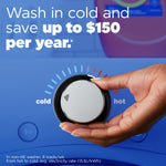 Hand adjusting a washer temperature dial from cold to hot with overlay text about washing in cold to save up to $150 per year and a blurred detergent in background.