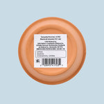 Bottom view of a terracotta pot with a white barcode label and product/manufacturer text affixed to the base.