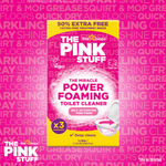 Bold marketing image of The Pink Stuff Power Foaming Toilet Cleaner box centered on a pink patterned background.