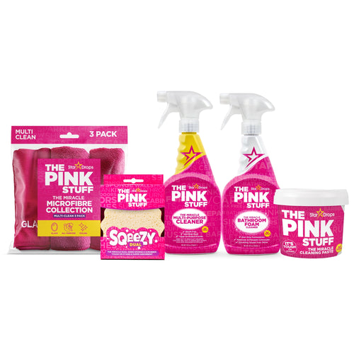 Studio product lineup of The Pink Stuff cleaning paste, two pink spray bottles, a sqeezy sponge and pink microfibre cloth pack on white