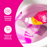 Close-up lifestyle shot of The Pink Stuff bottle dispensing pink gel into a toilet bowl with feature icons at left