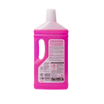 Rear view of a translucent pink bottle of The Pink Stuff floor cleaner showing back label and handle