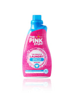 Bottle of The Pink Stuff Miracle Laundry Sensitive Detergent with blue cap shown on white background.