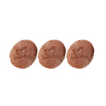 Three copper-colored round scouring pads arranged in a row on a white background, textured metal mesh visible