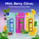 Three Grin Strips blister packs in mint, pink and orange packaging representing mint, berry and citrus flavor varieties