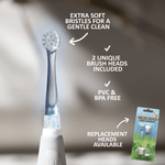 Close-up brush head on a white Jack N' Jill Tickle Tooth electric toothbrush with text noting extra soft bristles and replacement heads available