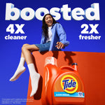 Promotional scene with a person sitting above an orange Tide jug and large 'boosted' claim with cleaner and fresher callouts