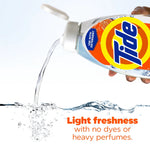 Close-up action shot of a Tide Clean Boost bottle being poured, with water splash and text about light freshness at the bottom.