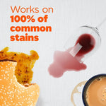 Close-up stain-themed graphic showing a burger, spilled wine, and coffee ring with text 'Works on 100% of common stains'.