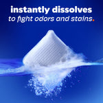 Single Tide evo detergent tile dissolving in water with splashes and 'instantly dissolves' headline