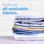 Stack of folded washable clothes against a tiled background with text stating safe on all washable fabrics