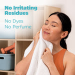 Person enjoying the softness of a white towel with text about no irritating residues, no dyes, no perfume