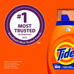 Partial view of a Tide bottle beside a circular '#1 Most Trusted by Americans 2023' BrandSpark badge on an orange background.