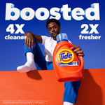 Person seated behind a large Tide Original bottle with bold text claiming “boosted” and performance metrics