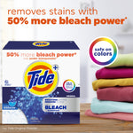 Tide Plus Bleach powder box next to a stack of folded colorful laundry with '50% more bleach power' headline.