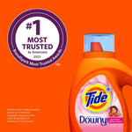Partial bottle of Tide Plus Downy April Fresh with circular #1 most trusted badge on orange background