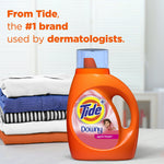 Tide Plus Downy April Fresh bottle staged next to folded laundry with text claiming Tide is the #1 brand used by dermatologists