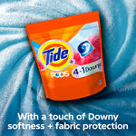 Tide PODS 4 in 1 Downy orange pouch placed on a textured blue fabric with messaging about Downy softness.