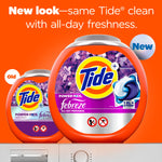 Two orange Tide Power PODS Febreze tubs on an orange background showing old and new packaging with 'New look' text.