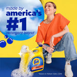 Lifestyle graphic with person crouching beside a Tide Simply jug covered in foam and a blue sky window proclaiming America’s #1 detergent brand